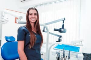 dental hygienist smiles as she waits for her next patient to come