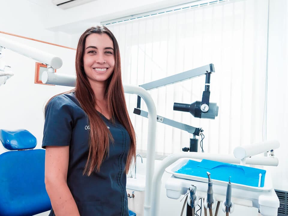 dental hygienist smiles as she waits for her next patient to come