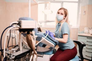 dental anesthesiologist is giving sedation dentistry to one of her patients