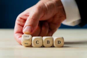 a photo of some letter cubes spelling out CBD to allude to the question of can cbd alleviate dental anxiety