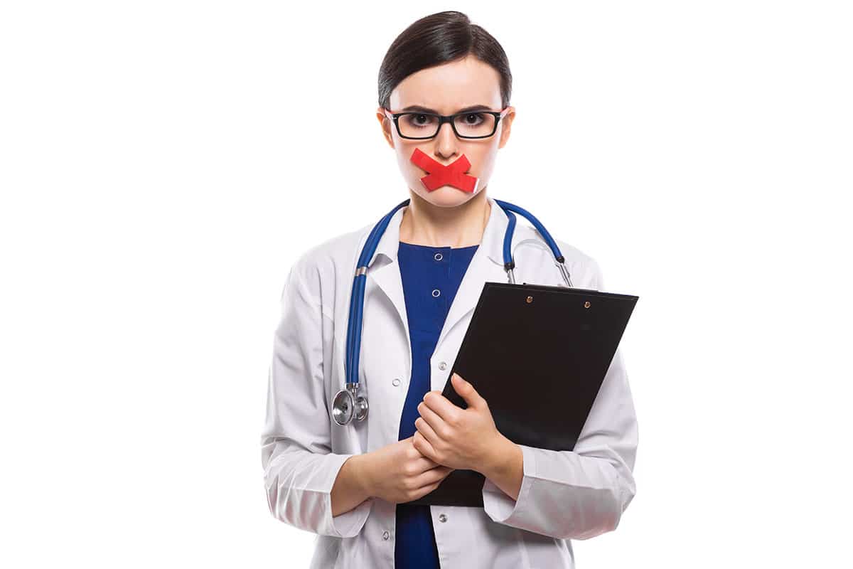 female dentist with tape over her mouth so she doesn't start cursing at patients who skip dental cleaning appointments
