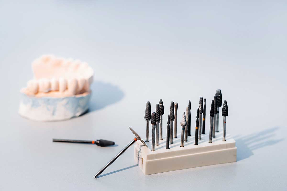 set of dental tools used to clean up a tooth impression for a bruxism mouth guard