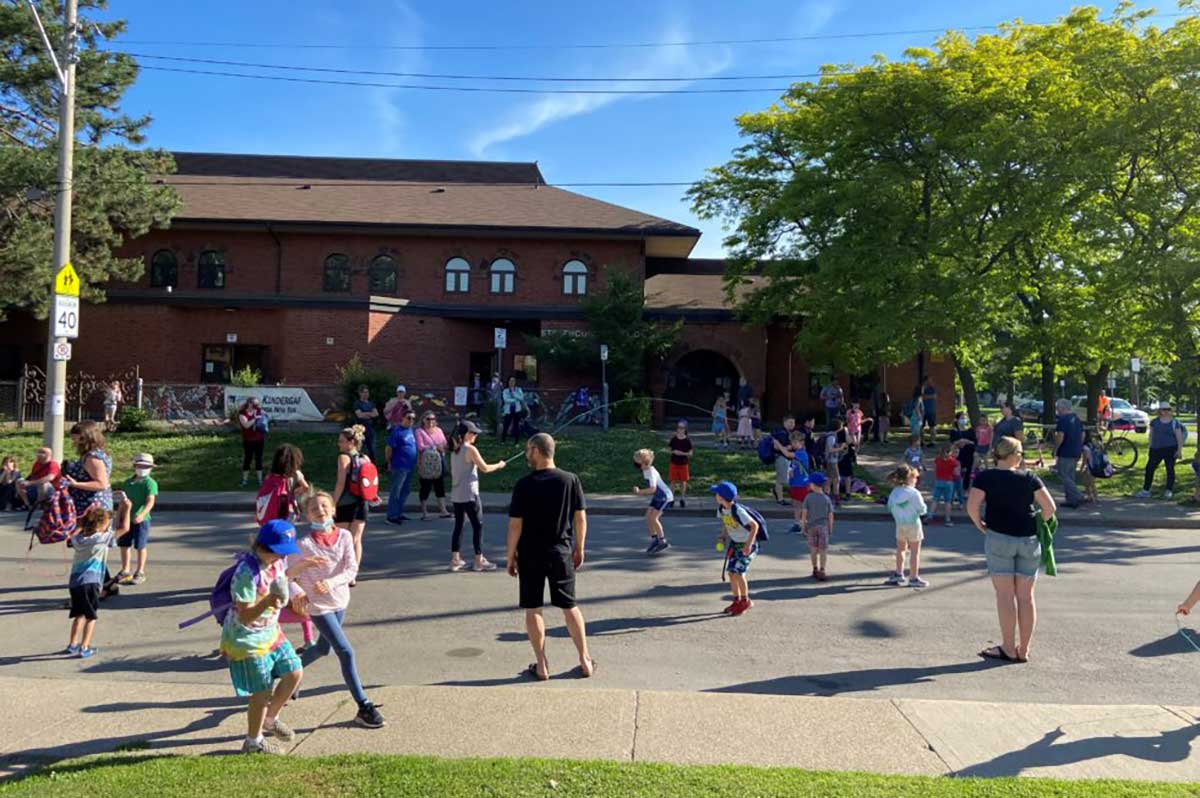 image showing kids playing in front of a public school in Hamilton Ontario
