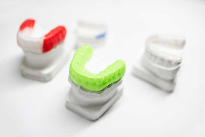 a bunch of mouthguards on a table