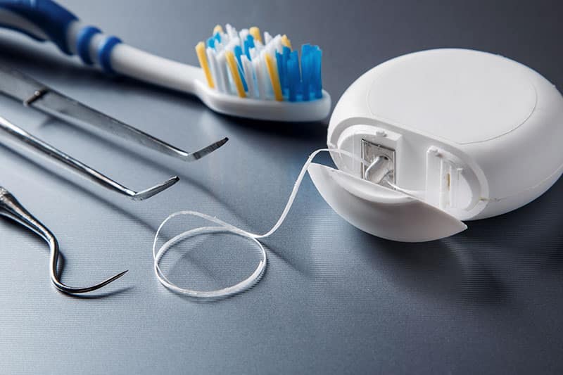 toothbrush, floss and picks make up the preventative dentistry toolkit