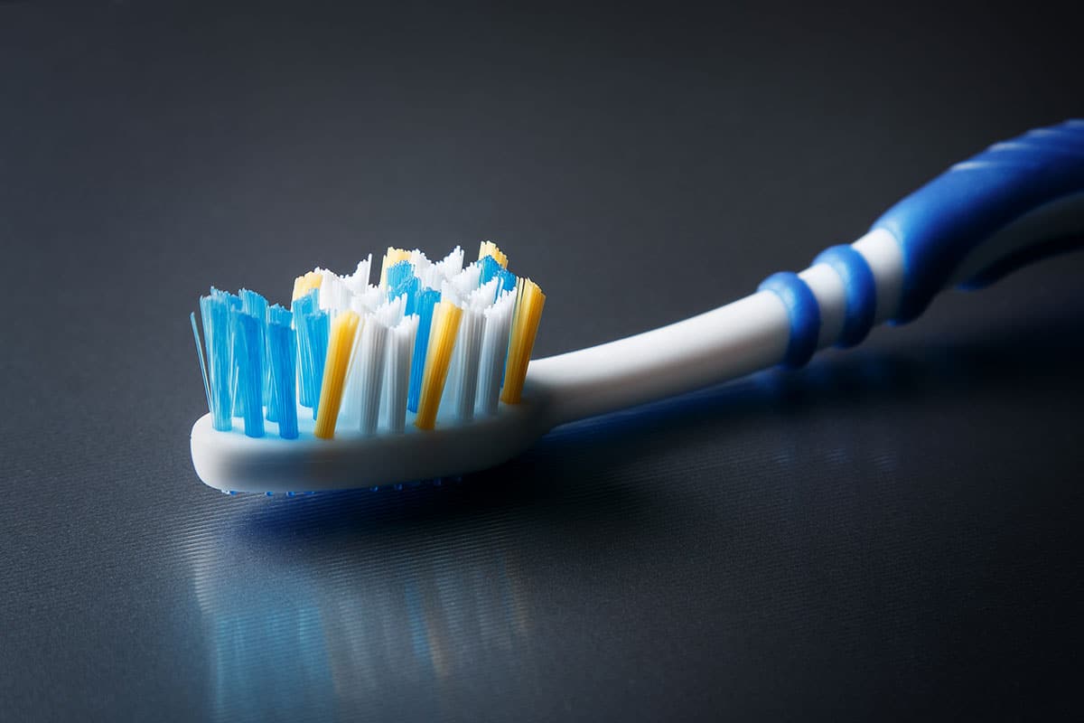 photo of an old toothbrush on dark background