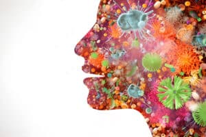 benefits of dental probiotics hero image showing a silhouette of a face with a microbiome inside